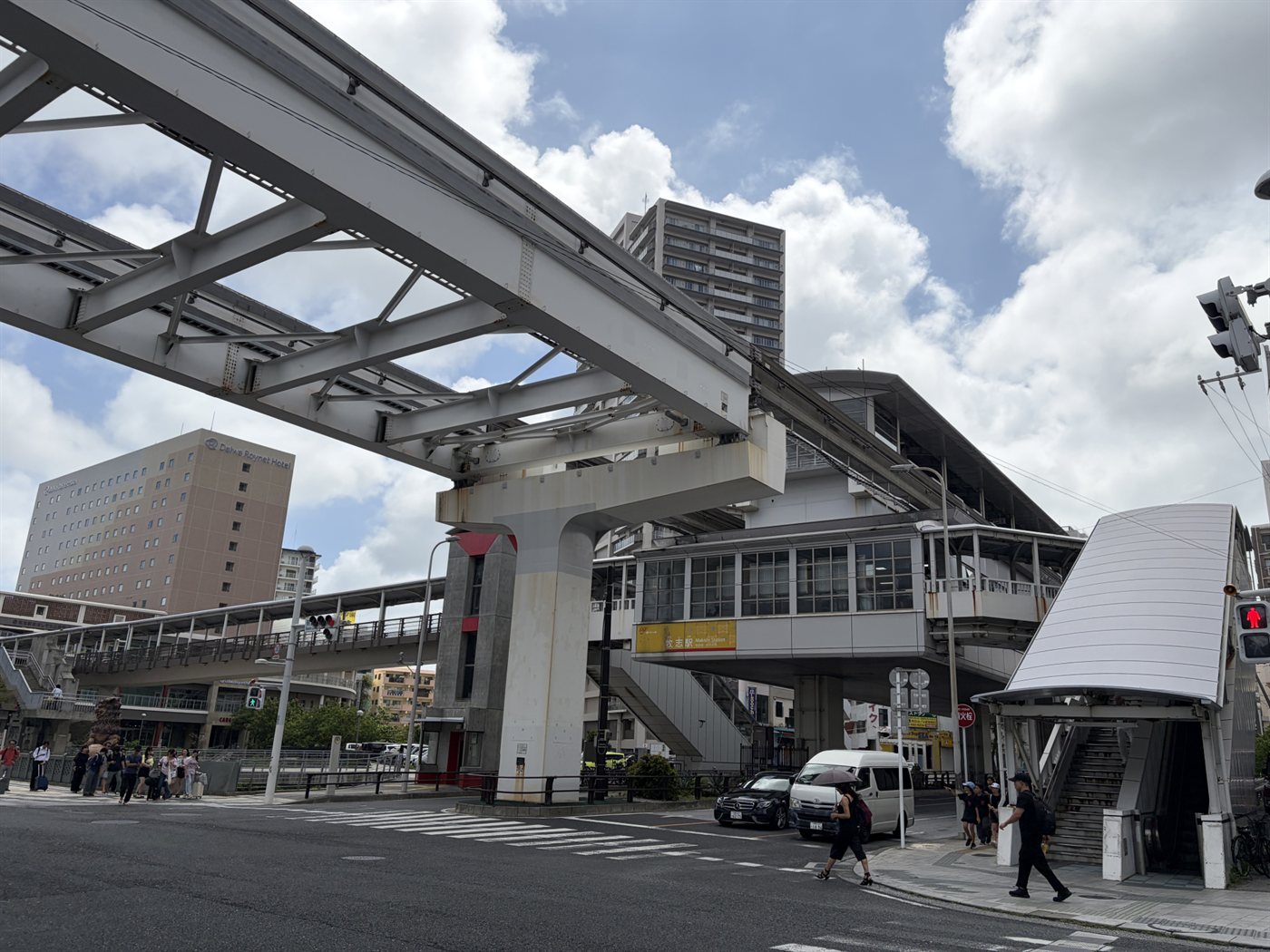 A street scene in Naha, Okinawa, with the monorail viaduct overhead